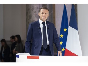 Emmanuel Macron arrives for a press conference in Paris on June 12.