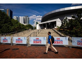 Signage outside of the McCamish Pavilion on the Georgia Institute of Technology campus ahead of the first presidential debate in Atlanta, Georgia, US, on Wednesday, June 26, 2024. President Joe Biden and former President Donald Trump will face off Thursday for their first 2024 debate, a high-stakes opportunity to break through to politics-weary Americans and one that holds the potential for disastrous missteps.