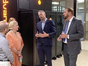 D-Wave's Chief Development Officer Dr. Trevor Lanting (center) showcasing D-Wave technology with Jagrup Brar, B.C. Minister of State for Trade and MLA for Surrey-Fleetwood (right) and Janet Routledge, B.C. Parliamentary Secretary for Labour and MLA for Burnaby North (left).