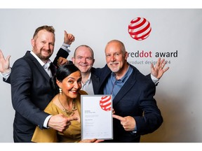 (From left to right): Mark Williams, Perla Munhoz, Wayne Stant, and Paul Wright of Traka pose with the 2024 Red Dot Award for Product Design. The award was presented to Traka for its Traka Touch Pro line of intelligent key cabinets.