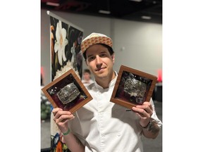 Executive Chef of Salt & Brick, holding his awards for 'Best Overall' dish and "Most Innovative" dish.