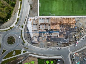 A new report from the Canadian Urban Institute says that as Canada aims to accelerate the pace of housing construction, both the public and private sectors will need to boost spending on municipal infrastructure. A rental apartment complex is seen under construction at a new housing development in Langford, B.C., Thursday, May 30, 2024.