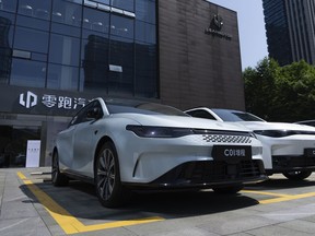 FILE - Leapmotor vehicles are parked outside a showroom in Hangzhou in eastern China's Zhejiang province on May 14, 2024. China and the European Union are open to holding talks on the EU's recent decision to sharply raise tariffs on imports of Chinese-made electric vehicles, officials from both sides say.