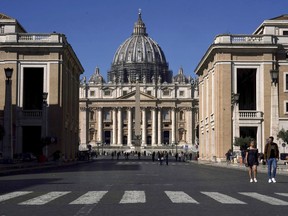 FILE - View of the Basilica of St.  Peter in the Vatican, March 11, 2020. The Vatican was forced to stand trial in a London court on Wednesday, as the British financier seeks to recover from reputational damage it says it has suffered.  Vatican investigation into a 350 million euro investment in London property.