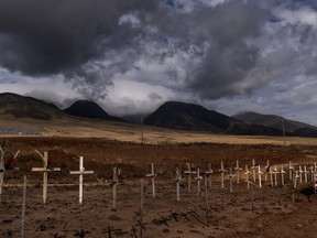 When wind-driven wildfires broke out on the Hawaiian island of Maui last summer, killing more than 100 people and destroying 2,200 buildings, many local residents didn't know the extent of the disaster for days. Crosses honoring victims killed in a recent wildfire are posted along the Lahaina Bypass in Lahaina, Hawaii, Aug. 21, 2023. Evacuation orders in Lahaina were complicated by a telecommunications blackout, caused by the downing of all cellular and landline fibre and copper lines.