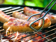 Barbequing meat on a grill