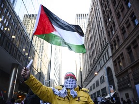 People take part in a demonstration in support of Palestine in Toronto on Nov. 12, 2023.