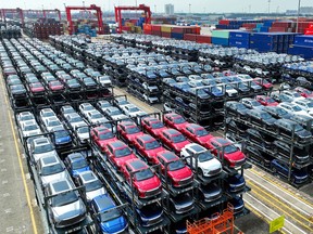 Electric cars awaiting to be loaded onto a ship at the international container terminal of Taicang Port at Suzhou Port, in China's eastern Jiangsu Province.