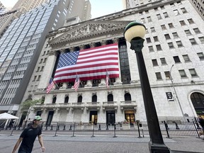 File - People pass the New York Stock Exchange on May 28, 2024, in New York. Global shares have advanced on Friday, June 28, 2024, as traders look ahead to a key report on inflation that could influence the Federal Reserve's next move on interest rates.