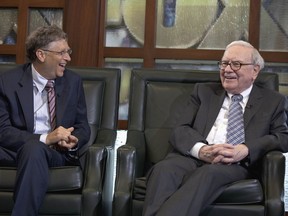 FILE - Warren Buffett, chairman and CEO of Berkshire Hathaway, right, looks at Microsoft founder and Berkshire board member Bill Gates during an interview with Liz Claman of the Fox Business Network in Omaha, Neb., May 7, 2012. Buffett announced another $5.3 billion in charitable gifts Friday, June 28, 2024, but in a major shift of his longtime giving plan, he says he plans to cut off donations to the Bill & Melinda Gates Foundation after his death and let his three children decide how to distribute the rest of his $128 billion fortune.