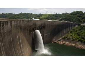 Flood gates on the Kariba Dam between Zimbabwe and Zambia open ceremonially on Feb. 20, 2015 after the neighbors signed a deal with investors.