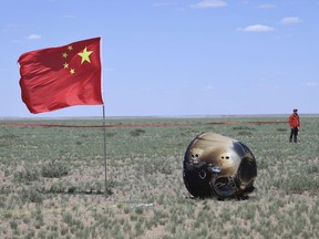 In this photo released by Xinhua News Agency, the return capsule of the Chang'e 6 probe is seen in Siziwang Banner, northern China's Inner Mongolia Autonomous Region on Tuesday, June 25, 2024. China's Chang'e 6 probe has returned on Earth with rock and soil samples from the little-explored far side of the moon in a global first.