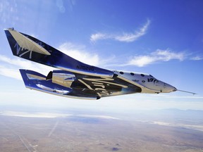 This May 29, 2018 photo provided by Virgin Galactic shows the VSS Unity craft during a supersonic flight test.