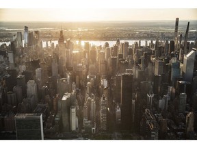 Buildings in the Manhattan skyline in New York, USA, Thursday, June 17, 2021. The pandemic mandate in New York state was lifted last week, after 70% of the adult population has now been given at least one dose of the coronavirus vaccine.  Photographer: Victor J. Blue/Bloomberg