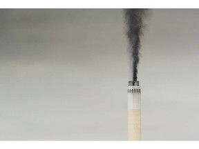 Emissions rise from a chimney. Photographer: Waldo Swiegers/Bloomberg