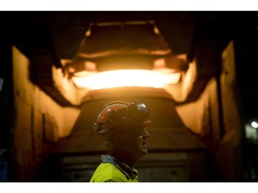 An employee in front of a steel furnace at BlueScope Steel Ltd. Port Kembla steelworks in Australia.