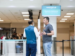 WestJet is still feeling the effects of a mechanics strike, a week after it ended. Passengers are seen in the WestJet check-in area at Toronto's Pearson International Airport on Saturday, June 29, 2024.