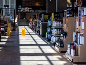 A view through a window into a LCBO store in Toronto. The Ontario government decided against reopening some stores during the store.