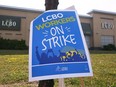 A LCBO strike sign is shown at the store in Windsor Friday. More than 9,000 LCBO unionized employees started the strike early Friday.