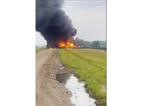 This photo provided by Doug Zink, smoke fills the sky after a train derailment on Friday, July 5, 2024 near Carrington, N.D. Rail cars containing hazardous material derailed and burst into flames early Friday in a remote area of North Dakota, but emergency officials say no one was hurt and the threat to those living nearby appears to be minimal. (Doug Zink via AP)