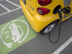 An electric vehicle getting charged at a parking lot in B.C.