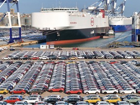 Electric cars for export waiting to be loaded on a vessel at Yantai port in China.