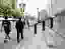 Pedestrians walk past the Bank of Canada in Ottawa.