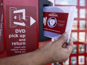 FILE - A rental DVD is dispensed from a Redbox at a 7-Eleven in Los Angeles on August 7, 2009. Chicken Soup for the Soul Entertainment, the owner of DVD rental operator Redbox, filed for Chapter 11 bankruptcy protection, Friday, June 28, 2024.
