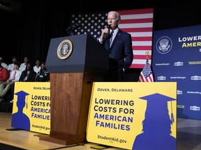 FILE - President Joe Biden speaks about student loan debt relief at Delaware State University, Oct. 21, 2022, in Dover, Del. A federal appeals court has allowed the U.S. Education Department to move ahead with a plan to lower monthly payments for millions of student loans borrowers.
