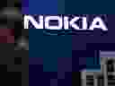 A man crossed the Nokia logo at the Mobile World Congress (MWC) held in Barcelona on February 25, 2019.