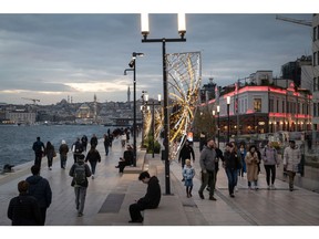 Shoppers and pedestrians walk along the banks of the Bosphorus strait, by Galataport in the Karakoy district of Istanbul, Turkey, on Thursday, Jan. 4, 2024. The lira is headed for its biggest weekly loss in almost six months as emerging market currencies sink under a stronger dollar.