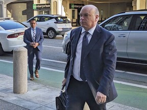 FILE - British tech magnate Mike Lynch walks into federal court in San Francisco, March 26, 2024,