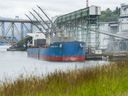 A cargo ship is loaded with grain at the Viterra Cascade Terminal in Vancouver Tuesday, June 21, 2022.