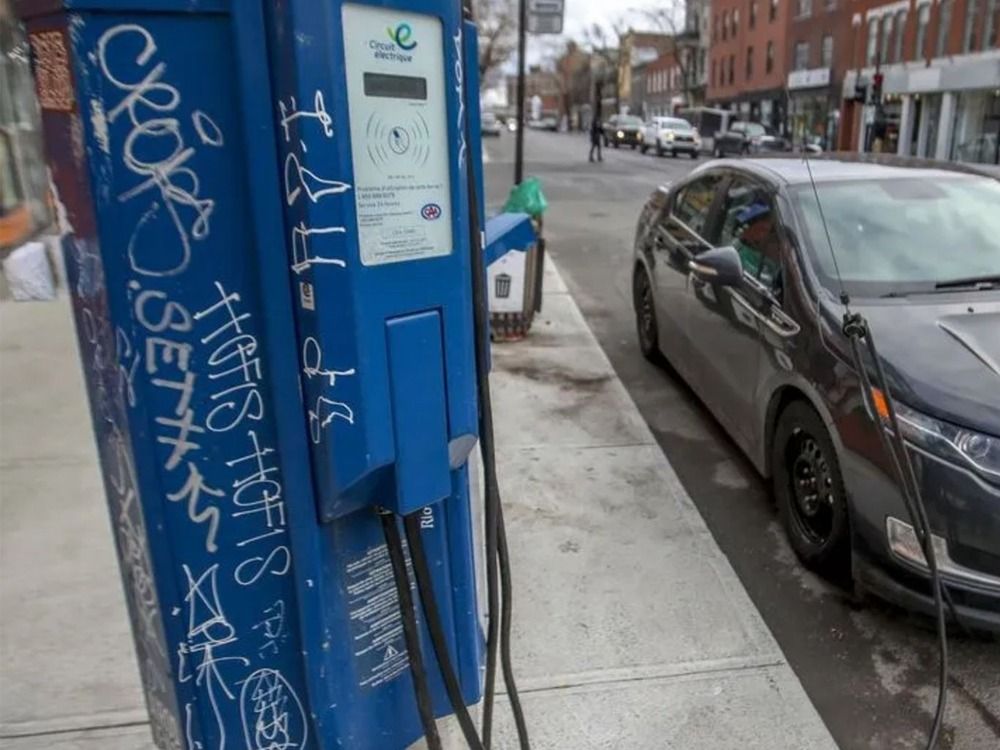 An EV charging station powering up a Chevrolet Volt in Quebec.