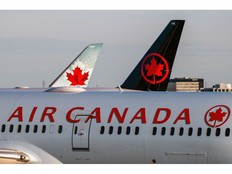 Air Canada planes on the tarmac at Toronto Pearson International Airport.