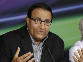 FILE - Singapore's Second Minister for Home Affairs & Trade and Industry S. Iswaran speaks during a news conference in Singapore, Sept. 22, 2012, to announce that Singapore will continue to host the Formula One Grand Prix at the Marina Bay City Circuit for the next five years.