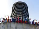 Flags of international countries outside the headquarters of the Bank for International Settlements in Basel, Switzerland.