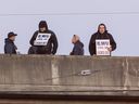 Port workers on the Clark street overpass (north foot of Clark) in Vancouver, B.C., Nov. 4, 2024.