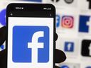 The Facebook logo is seen on a mobile phone, Oct. 14, 2022, in Boston.