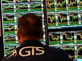 A trader works on the floor at the closing bell on October 1, 2024 at the New York Stock Exchange in New York.