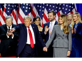 Former US President Donald Trump, from second left, Usha Chilukuri Vance, wife of JD Vance, Senator JD Vance, a Republican from Ohio and Republican vice-presidential nominee, former US First Lady Melania Trump, and Ivanka Trump, former senior adviser to Donald Trump, during an election night event at the Palm Beach Convention Center in West Palm Beach, Florida, US, on Wednesday, Nov. 6, 2024. Trump is on the cusp of recapturing the White House, projected as the winner across pivotal swing states with his party set to control the Senate and markets swinging in expectation of his possible victory.