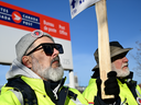 Canada Post workers picket outside a sorting plant in Montreal on Nov.15, 2024.