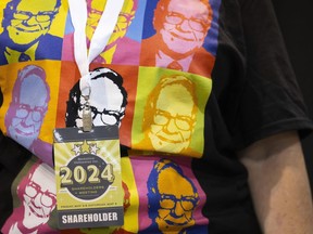 FILE - Shareholder Tina Schmidt of Cozad, Neb., wears a shirt with Warren Buffett's portrait in the style of an Andy Warhol painting at the Berkshire Hathaway annual meeting on May 4, 2024, in Omaha, Neb.