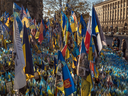 People visit a makeshift memorial paying tribute to Ukrainian and foreign fighters, on the 1,000th day of the Russian invasion of Ukraine, at Independence Square in Kyiv, on Nov. 19, 2024.