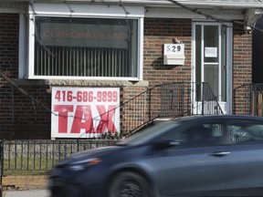 A Tax office on Victoria Park Ave. South of Danforth Ave. in Scarborough touts e-files, personal and corporate taxes on December 12, 2024.