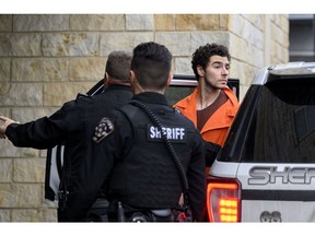 Luigi Mangione is led into the Blair County Courthouse for an extradition hearing in Hollidaysburg, Pennsylvania, on Dec. 10. Photographer: Jeff Swensen/Getty Images