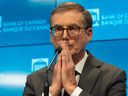 Bank of Canada Governor Tiff Macklem takes questions during the press conference after policy makers cut the interest rate by half a point on Dec. 11.