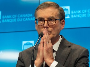 Bank of Canada Governor Tiff Macklem takes questions during the press conference after policy makers cut the interest rate by half a point on Dec. 11.