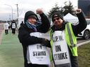 Canada Post workers picket outside a Canada Post processing center in Richmond, British Columbia, on December 2.