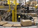 Products are moved through the process at an Amazon.com Inc. fulfilment centre in London, England.